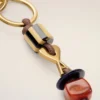 Breloc Ami de Coeur din piele maro și metal cu perle Breloc Ami de Coeur din piele maro și metal cu perle