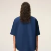 Cămașă albastră din bumbac, croială dreaptă, cu broderie Ami de Coeur Cămașă albastră din bumbac, croială dreaptă, cu broderie Ami de Coeur