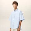 Cămașă albastră din bumbac, croială dreaptă, cu broderie Ami de Coeur Cămașă albastră din bumbac, croială dreaptă, cu broderie Ami de Coeur