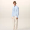 Cămașă albastră din bumbac cu mâneci lungi, cu volane și croială ajustată Cămașă albastră din bumbac cu mâneci lungi, cu volane și croială ajustată
