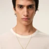 Colier cu pandantiv „9” din alamă aurie ciocănită Colier cu pandantiv „9” din alamă aurie ciocănită