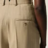 Pantaloni bej din lână virgină, cu talie înaltă și picior larg