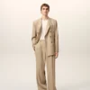 Pantaloni largi din lână nouă, de culoare bej, cu talie joasă Pantaloni largi din lână nouă, de culoare bej, cu talie joasă