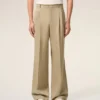 Pantaloni largi din lână nouă, de culoare bej, cu talie joasă Pantaloni largi din lână nouă, de culoare bej, cu talie joasă