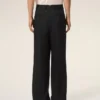 Pantaloni largi din lână nouă, de culoare neagră, cu talie joasă Pantaloni largi din lână nouă, de culoare neagră, cu talie joasă