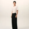 Pantaloni largi din lână nouă, de culoare neagră, cu talie joasă Pantaloni largi din lână nouă, de culoare neagră, cu talie joasă