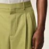 Pantaloni largi din lână nouă, de culoare verde, cu talie joasă Pantaloni largi din lână nouă, de culoare verde, cu talie joasă