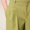 Pantaloni largi din lână nouă, de culoare verde, cu talie joasă Pantaloni largi din lână nouă, de culoare verde, cu talie joasă