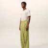 Pantaloni largi din lână nouă, de culoare verde, cu talie joasă Pantaloni largi din lână nouă, de culoare verde, cu talie joasă