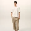 Pantaloni oversized bej din bumbac, croi carotă