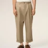 Pantaloni oversized bej din bumbac, croi carotă