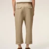 Pantaloni oversized bej din bumbac, croi carotă