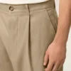 Pantaloni oversized bej din bumbac, croi carotă