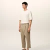 Pantaloni oversized bej din bumbac, croi carotă