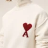 Pulover din lână naturală cu guler în formă de pâlnie și broderie Ami de Coeur în contrast Pulover din lână naturală cu guler în formă de pâlnie și broderie Ami de Coeur în contrast