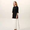 Tricou negru din satin cu mâneci scurte și detalii din tricot Tricou negru din satin cu mâneci scurte și detalii din tricot