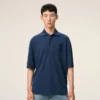 Tricou polo albastru din bumbac cu patch-uri tricotate Ami de Coeur Tricou polo albastru din bumbac cu patch-uri tricotate Ami de Coeur