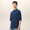 Tricou polo albastru din bumbac cu patch-uri tricotate Ami de Coeur Tricou polo albastru din bumbac cu patch-uri tricotate Ami de Coeur
