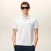 Tricou polo Ami de Coeur din bumbac alb, cu mâneci scurte Tricou polo Ami de Coeur din bumbac alb, cu mâneci scurte