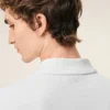 Tricou polo Ami de Coeur din bumbac alb, cu mâneci scurte Tricou polo Ami de Coeur din bumbac alb, cu mâneci scurte