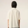 Tricou polo Ami de Coeur din bumbac alb, cu patch-uri tricotate Tricou polo Ami de Coeur din bumbac alb, cu patch-uri tricotate