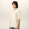 Tricou polo Ami de Coeur din bumbac alb, cu patch-uri tricotate Tricou polo Ami de Coeur din bumbac alb, cu patch-uri tricotate