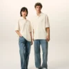 Tricou polo Ami de Coeur din bumbac alb, cu patch-uri tricotate Tricou polo Ami de Coeur din bumbac alb, cu patch-uri tricotate