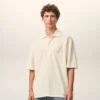 Tricou polo Ami de Coeur din bumbac alb, cu patch-uri tricotate Tricou polo Ami de Coeur din bumbac alb, cu patch-uri tricotate