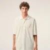 Tricou polo Ami de Coeur din bumbac alb, cu patch-uri tricotate Tricou polo Ami de Coeur din bumbac alb, cu patch-uri tricotate