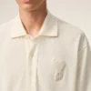 Tricou polo Ami de Coeur din bumbac alb, cu patch-uri tricotate Tricou polo Ami de Coeur din bumbac alb, cu patch-uri tricotate