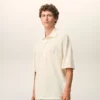 Tricou polo Ami de Coeur din bumbac alb, cu patch-uri tricotate Tricou polo Ami de Coeur din bumbac alb, cu patch-uri tricotate
