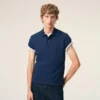 Tricou polo Ami de Coeur din bumbac albastru cu mâneci scurte Tricou polo Ami de Coeur din bumbac albastru cu mâneci scurte