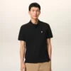 Tricou polo Ami de Coeur din bumbac negru cu mâneci scurte Tricou polo Ami de Coeur din bumbac negru cu mâneci scurte