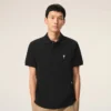 Tricou polo Ami de Coeur din bumbac negru cu mâneci scurte Tricou polo Ami de Coeur din bumbac negru cu mâneci scurte