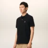 Tricou polo Ami de Coeur din bumbac negru cu mâneci scurte Tricou polo Ami de Coeur din bumbac negru cu mâneci scurte