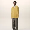 Tricou polo cu mâneci lungi din lână galbenă Tricou polo cu mâneci lungi din lână galbenă