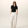Tricou polo negru din tricot cu mâneci scurte Tricou polo negru din tricot cu mâneci scurte