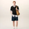 Tricou polo negru din tricot cu mâneci scurte Tricou polo negru din tricot cu mâneci scurte