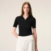 Tricou polo negru din tricot cu mâneci scurte Tricou polo negru din tricot cu mâneci scurte