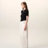Tricou polo negru din tricot cu mâneci scurte Tricou polo negru din tricot cu mâneci scurte