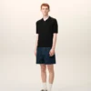 Tricou polo negru din tricot cu mâneci scurte Tricou polo negru din tricot cu mâneci scurte